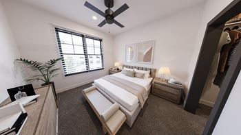 A bedroom with a large bed, a ceiling fan, and a window with blinds.
